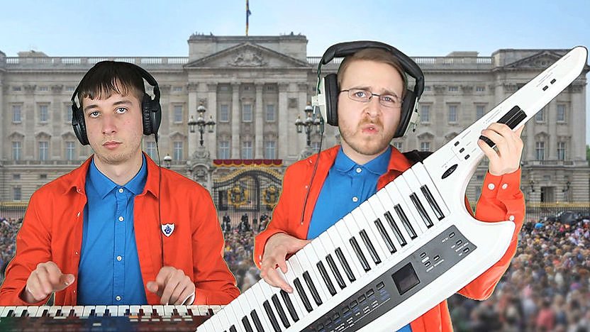 Brett Domino play their instruments in front of Buckingham Palace