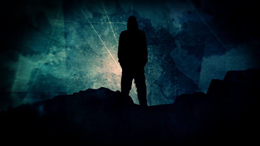 a shadowy figure on a hill.