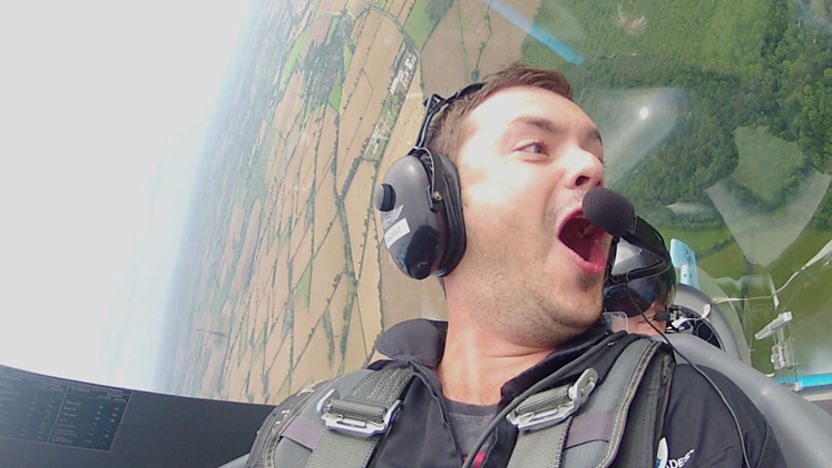 Barney harwood in an aeroplane cockpit as he performs a loop the loop