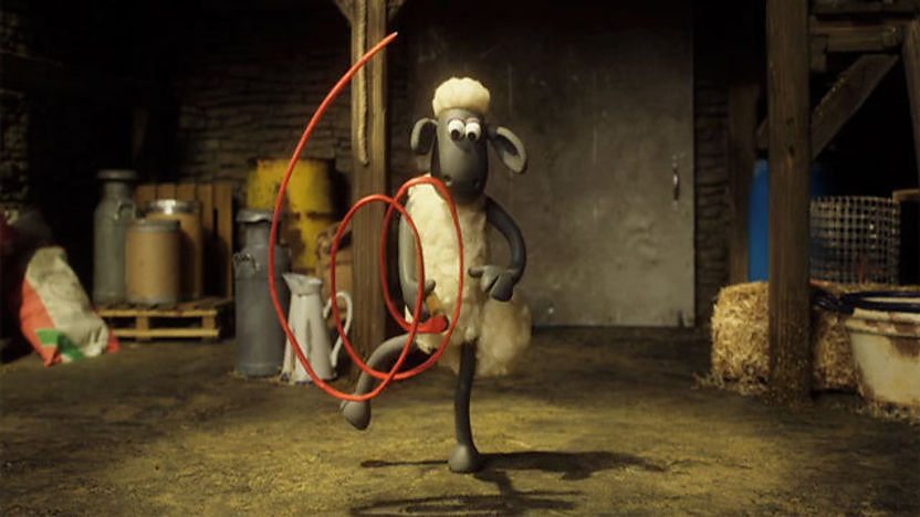 Shaun playing with a ribbon.