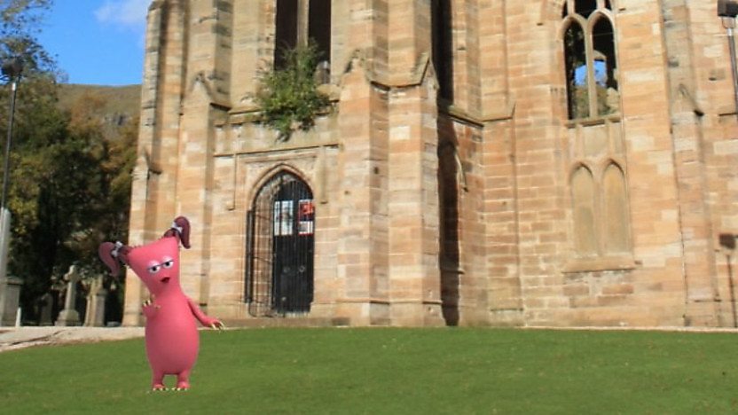 A bugbear in front of a church