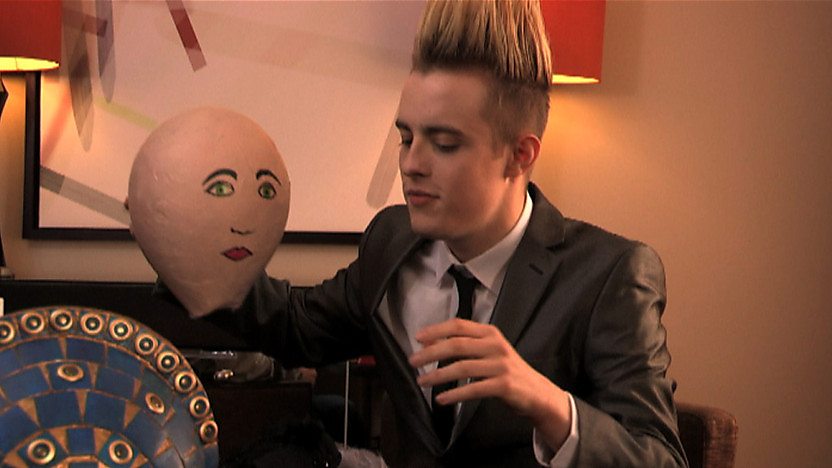 Edward holding a papier-mâché head