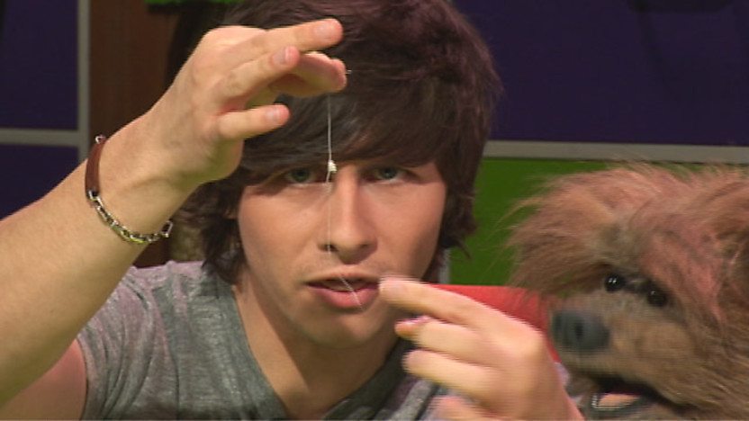 Ben holding a thread.