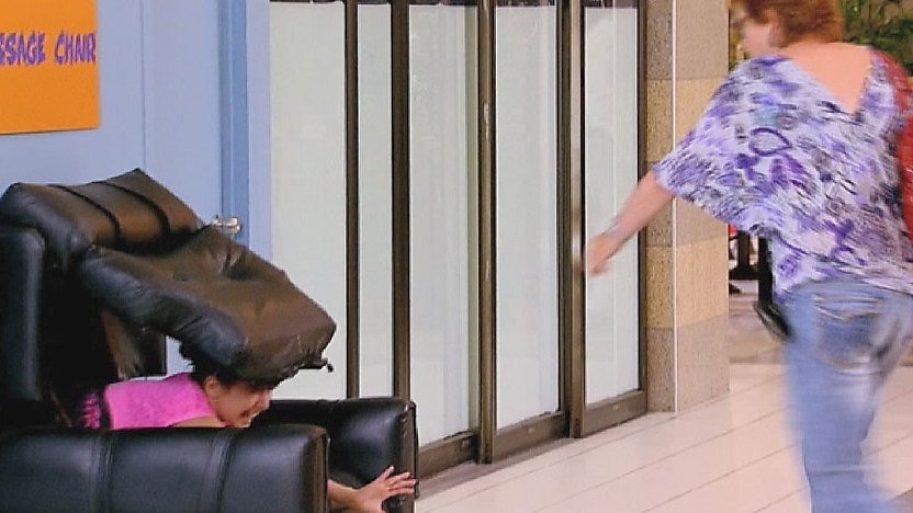 Girl being swallowed by chair and woman reaching to help her. 