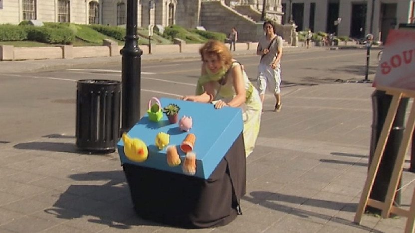 Woman trying to prevent table from falling over. 