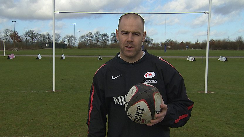 Rugby star Charlie Hodgeson holding a rugby ball