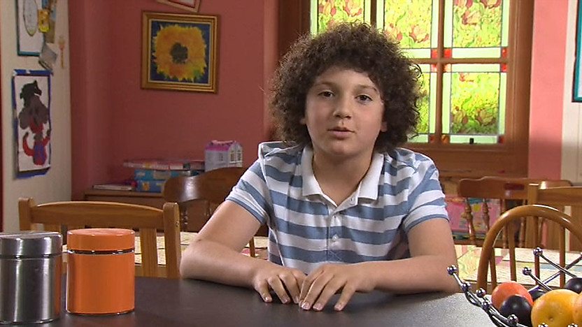 Tyler sitting at a table.