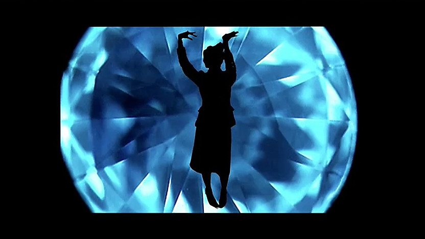 A diamond with a female silhouette in the centre