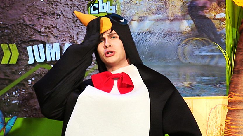 CBBC Office presenter Ben Hanlin looking confused, wearing a penguin costume.