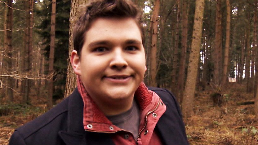 Chris Johnson pulling a funny face in the woods.