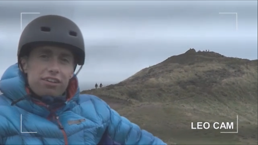 Leo on a bike riding up a hill.
