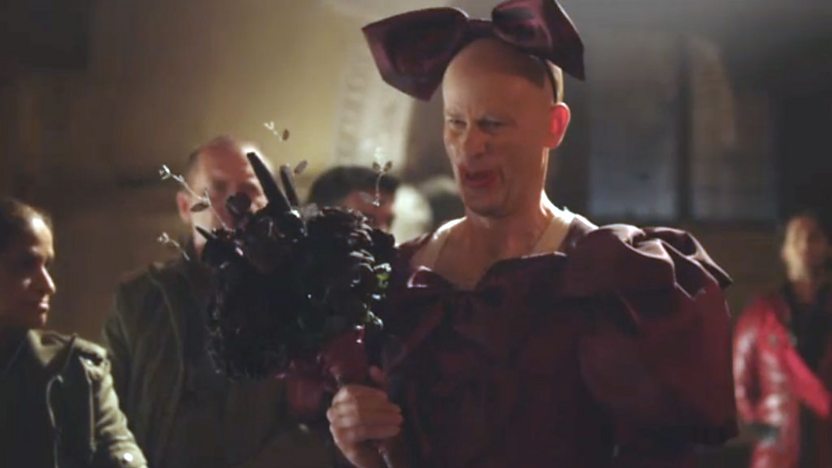 Renfield from Young Dracula wearing a dress