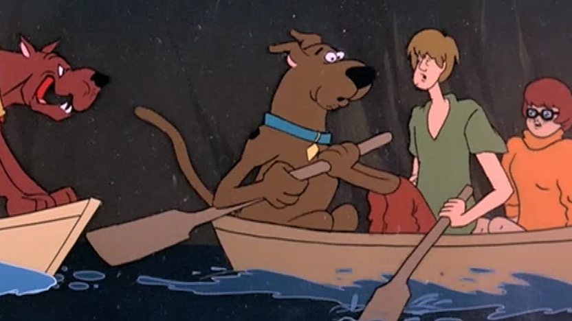 Scooby, Shaggy and Velma in a boat.