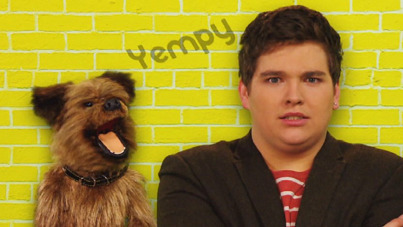 Chris and Hacker T Dog on a yellow background with the word 'Yempy' inbetween them.
