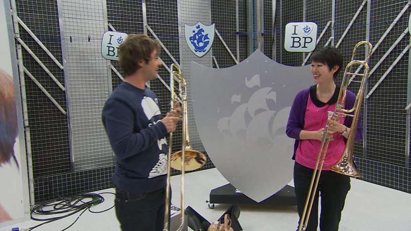 Barney playing the trombone