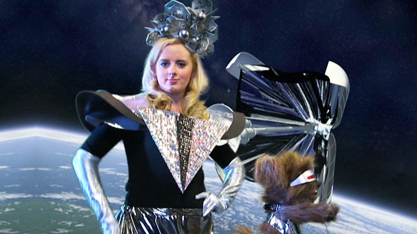 Katie Thistleton and Dodge T Dog on a space background dressed in futuristic outfits.