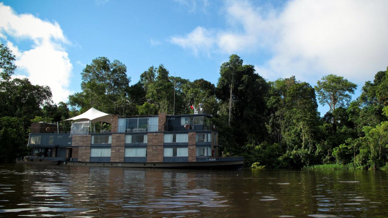 During three-, four- and seven-night cruises through the Peruvian Amazon, the M/V Aqua provides respite from the sensory assault of the river, cinematically framing its churning waters with floor-to-ceiling windows. (Colleen Clark) (Credit: Colleen Clark)