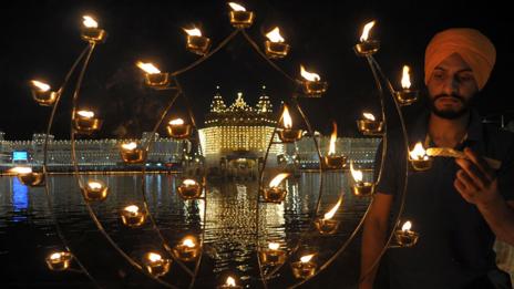 An Indian Sikh lights candles during Bandi Chhor Divas, or Diwali (Getty Images)