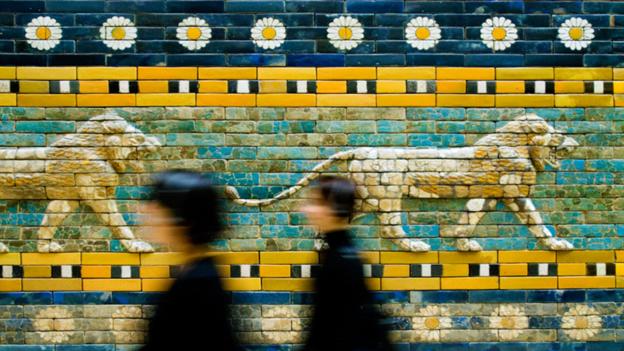 People walk in front of the Great Gate of Ishtar at the Pergamon Museum