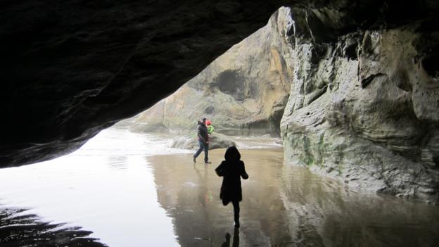 Exploring the caves at Hug Point park (Credit: Credit: David G Allan) Exploring the caves at Hug Point park (Credit: Credit: David G Allan)