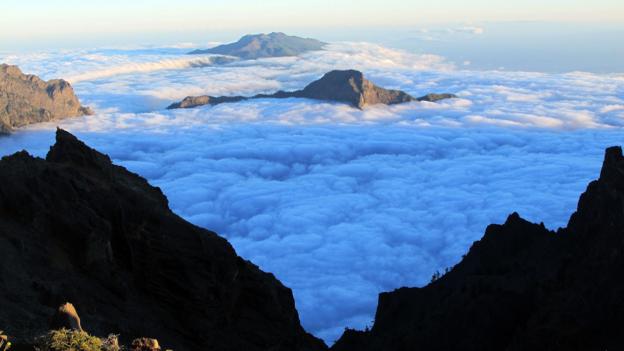Above the clouds (Credit: Credit: Tim Johnson) Above the clouds (Credit: Credit: Tim Johnson)