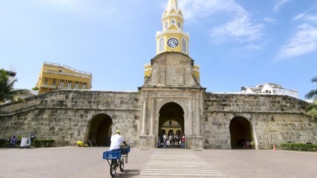 Bicycling through the Clock Tower in the walled city of Cartagena (Credit: Credit: Antonio Salinas L/Getty) Bicycling through the Clock Tower in the walled city of Cartagena (Credit: Credit: Antonio Salinas L/Getty)
