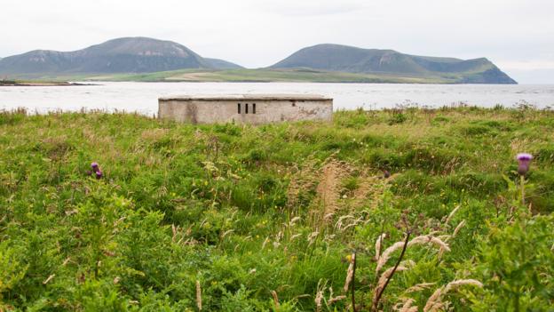 An abandoned pillbox looks over calm waters (Credit: Credit: Amanda Ruggeri) An abandoned pillbox looks over calm waters (Credit: Credit: Amanda Ruggeri)