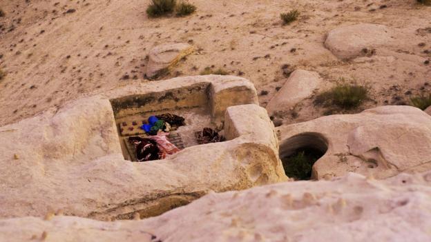 A cave cutout holds provisions (Credit: Credit: Will Jehring)