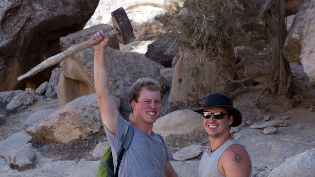 Ghassab arms the travellers with a sledgehammer for collecting firewood (Credit: Credit: Will Jehring)