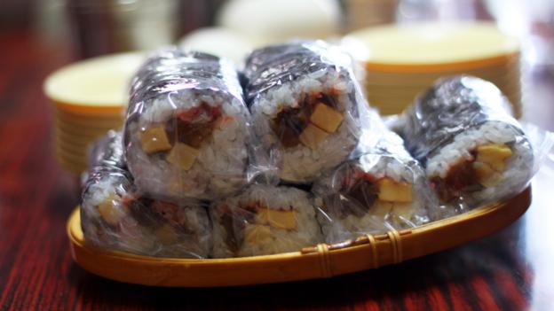Clingfilm wrapped sushi sits on each table (Credit: Credit: Danielle Demetriou)
