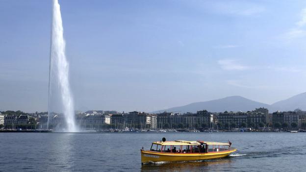 Lake Geneva's Jet d’Eau fountain attracts crowds in summer (Credit: Credit: Fabrice Coffrini/Getty)