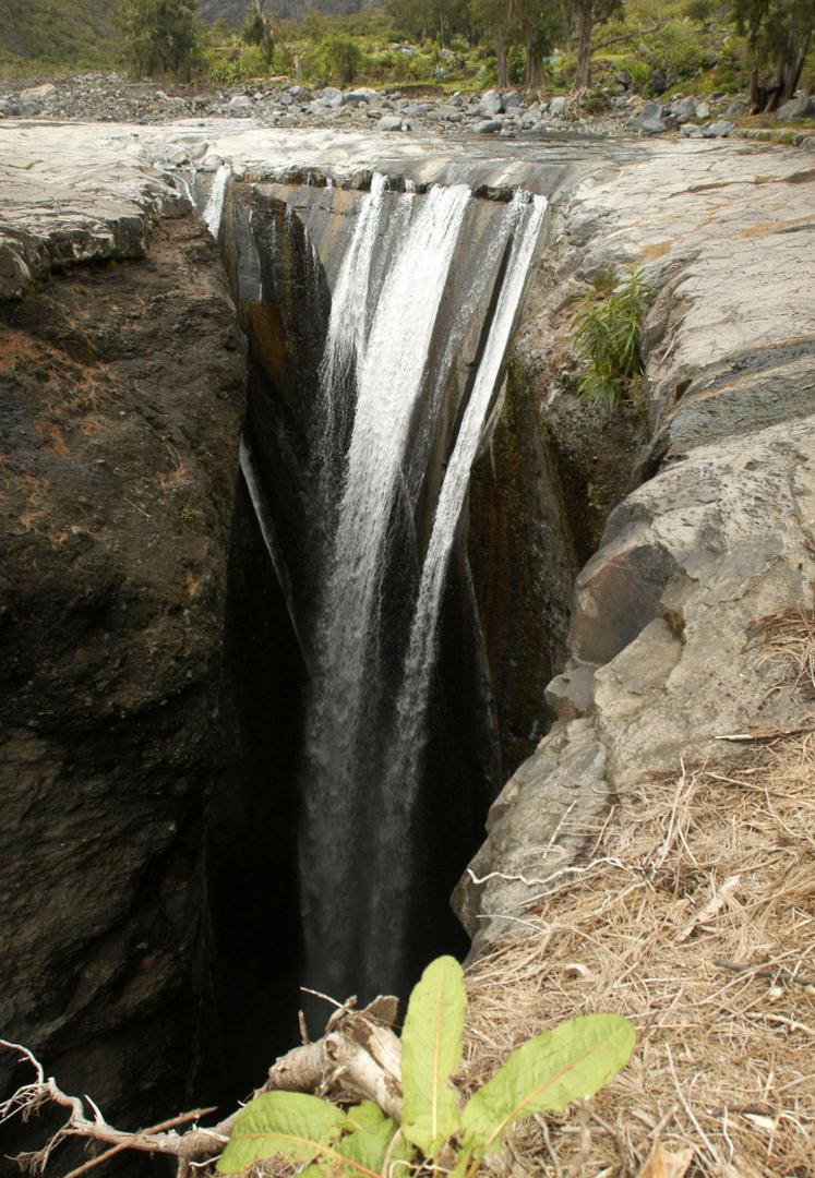 Travellers hiking to Cirque de Mafate will encounter beautiful scenery such as the Trois Roches waterfall (Credit: Credit: Ember Stefano/Alamy)