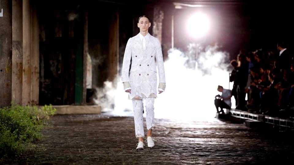 Curtain raiser At Alexander McQueen, suit of white lace.