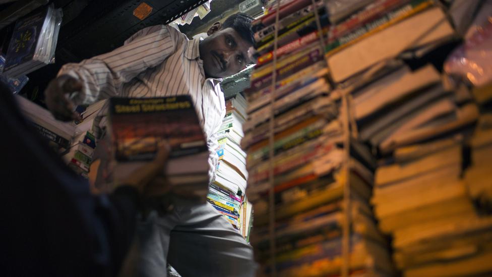 Stacks of books in an Indian store (Credit: Credit: AFP/Getty)