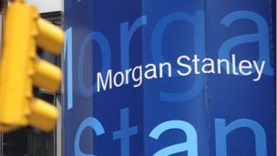 US banking giant Goldman Sachs reports a drop in net earnings while Morgan Stanley sees profits jump.