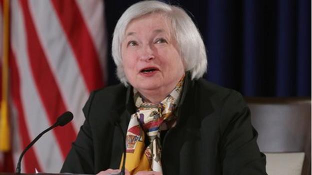 The US Federal Reserve signals a future rise in interest rates, but says it will wait until the labour market improves.