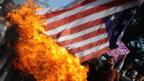Activists in Pakistan burn a US national flag (Copyright: Getty Images)