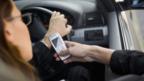 Woman texting whilst driving (Copyright: Thinkstock)