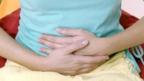 Woman holding her stomach