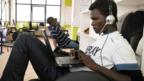 A man uses a laptop at iHub in Kenya (Copyright: Jonathan Kalan)