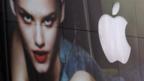 Apple logo reflected in a clothes store window (Copyright: Getty Images)