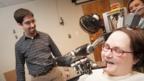 Paralysed woman's thoughts control robotic arm
