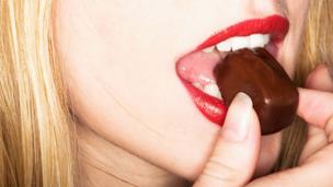 Woman eating chocolate (Copyright: Thinkstock)