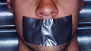 Man with tape on his mouth (Copyright: Thinkstock)