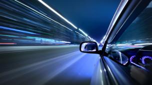 Car streakign past lights (Copyright: Thinkstock)