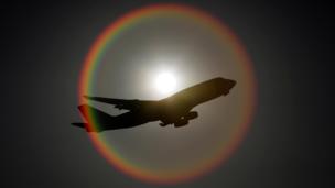 Plane surrounded by sun flare (Getty Images)