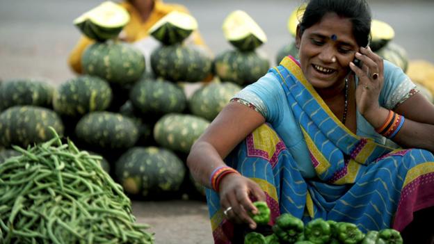 Indian lady on her phone (Copyright: Getty Images)