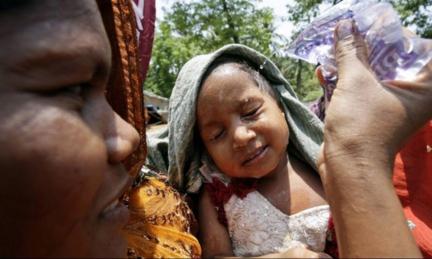 An Indian child tries to keep cool in the midst of the country's heat wave.