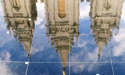 Cathedral mirrorred on a tile floor 