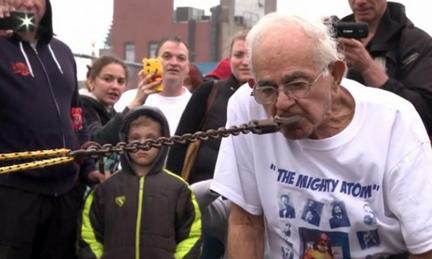92-year-old Mike Greenstein pulls a car with his teeth.
